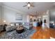 Comfortable living room open to kitchen, showcasing hardwood floors and modern decor at 359 Alderwood Ln, Atlanta, GA 30328