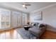 Open-concept living room featuring a plush sofa, a stylish rug, and lots of natural light at 359 Alderwood Ln, Atlanta, GA 30328