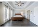 Spacious main bedroom with lots of natural light, tray ceiling, and hardwood floors at 359 Alderwood Ln, Atlanta, GA 30328