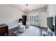 Bright home office with decorative chandelier, two chairs and large window at 359 Alderwood Ln, Atlanta, GA 30328