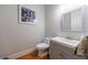 Small powder room with wood floors and grey vanity at 359 Alderwood Ln, Atlanta, GA 30328