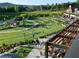 An aerial view of the neighborhood and a green area featuring community members enjoying recreation at 3740 Duckcove Way, Cumming, GA 30041