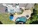 Aerial view showcasing deck, patio, backyard pool, and lush landscaping at 3740 Duckcove Way, Cumming, GA 30041