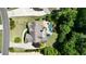 Aerial view of the home showcasing the backyard pool, landscaping, and surrounding trees at 3740 Duckcove Way, Cumming, GA 30041