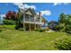 Expansive backyard featuring a screened porch, deck, lush lawn, patio and partial view of a swimming pool at 3740 Duckcove Way, Cumming, GA 30041