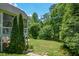 Green backyard with mature trees and landscaping at 3740 Duckcove Way, Cumming, GA 30041