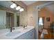 Bright bathroom with double sinks and view into the main bedroom at 3740 Duckcove Way, Cumming, GA 30041
