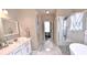 Bright bathroom offers a stylish walk-in shower and separate tub at 3740 Duckcove Way, Cumming, GA 30041