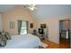 Comfortable bedroom with a vaulted ceiling and hardwood floors at 3740 Duckcove Way, Cumming, GA 30041