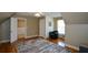 Bedroom with hardwood floors, a sitting chair and a window at 3740 Duckcove Way, Cumming, GA 30041