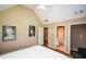 Bedroom with vaulted ceiling, neutral walls and a bathroom en suite at 3740 Duckcove Way, Cumming, GA 30041