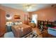 Bedroom with a queen bed, ceiling fan, and built-in shelves and desk at 3740 Duckcove Way, Cumming, GA 30041