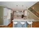 Modern kitchen featuring white cabinets, stainless steel appliances, and a spacious island at 3740 Duckcove Way, Cumming, GA 30041