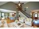 Spacious living room with tall ceilings, staircase, and abundant natural light at 3740 Duckcove Way, Cumming, GA 30041
