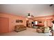 Open-concept living room with an adjacent billiards area and neutral color palette at 3740 Duckcove Way, Cumming, GA 30041