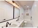 Stylish bathroom featuring a double vanity, tub, and shower with marble accents at 3774 Eli Dr, Snellville, GA 30039