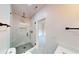 Sleek bathroom showcasing a glass-enclosed shower with modern fixtures and designer tile, creating a spa-like experience at 3774 Eli Dr, Snellville, GA 30039