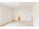 Bright and airy bedroom featuring double doors and board and batten accent wall, offering a serene retreat at 3774 Eli Dr, Snellville, GA 30039