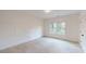 Bright bedroom with two windows, patterned wall and soft carpet at 3774 Eli Dr, Snellville, GA 30039
