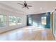 Spacious main bedroom with hardwood floors and many windows for natural lighting at 3774 Eli Dr, Snellville, GA 30039