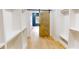 Walk-in closet with wooden floors and white built-in shelving units at 3774 Eli Dr, Snellville, GA 30039