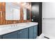 Double sink bathroom with stylish mirrors, wood accents, and under-mount sinks at 4462 Dandelion Ln, Atlanta, GA 30342