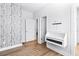 Bright bedroom with a stylish birch tree wallpaper accent wall and functional built in desk feature at 4462 Dandelion Ln, Atlanta, GA 30342