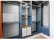 Walk-in closet featuring multiple shelves, hanger racks, and pull out laundry bins at 4462 Dandelion Ln, Atlanta, GA 30342