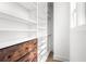 Walk-in closet featuring built-in shelving, drawers, and ample storage space at 4462 Dandelion Ln, Atlanta, GA 30342