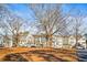 Picturesque neighborhood featuring well-maintained townhomes and mature trees at 4462 Dandelion Ln, Atlanta, GA 30342