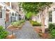 Picturesque view of townhomes along a landscaped walkway with gravel and pine straw at 4462 Dandelion Ln, Atlanta, GA 30342