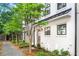 Charming townhomes featuring peach-colored front doors, black trim, and freshly landscaped yards at 4462 Dandelion Ln, Atlanta, GA 30342