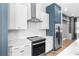 Modern kitchen featuring stainless steel appliances, white subway tiles, and stylish cabinetry, creating a contemporary cooking space at 4462 Dandelion Ln, Atlanta, GA 30342