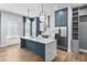 Stylish kitchen with a blue island, white countertops, and modern appliances, designed for both functionality and elegance at 4462 Dandelion Ln, Atlanta, GA 30342