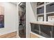 Modern laundry room features a stacked washer/dryer and built in storage at 4462 Dandelion Ln, Atlanta, GA 30342