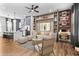 Open-concept living room with modern furnishings and decor, seamlessly connecting to the kitchen at 4462 Dandelion Ln, Atlanta, GA 30342