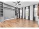 Spacious living room with wood floors, custom built-in shelving, and large windows at 4462 Dandelion Ln, Atlanta, GA 30342