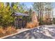 Community mailboxes with a stone tower in the background in a natural setting at 4462 Dandelion Ln, Atlanta, GA 30342
