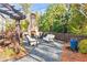 Cozy outdoor fireplace and seating area surrounded by lush landscaping, ideal for gatherings at 4462 Dandelion Ln, Atlanta, GA 30342