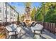 Cozy outdoor seating area with a stone fireplace, perfect for entertaining guests at 4462 Dandelion Ln, Atlanta, GA 30342