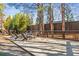 Outdoor lounging area with wooden deck, seating, and privacy fence surrounded by trees at 4462 Dandelion Ln, Atlanta, GA 30342
