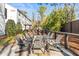 Outdoor lounge area with wooden furniture, offering a peaceful setting for relaxation and socializing at 4462 Dandelion Ln, Atlanta, GA 30342