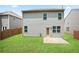Home exterior features a well-manicured yard with a patio at 4630 Roseman Trl, Cumming, GA 30040
