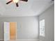 Bedroom featuring ceiling fan, door to adjoining room and window for natural light at 4630 Roseman Trl, Cumming, GA 30040