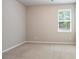Neutral bedroom with a window that lets in natural light with a carpeted floor at 4630 Roseman Trl, Cumming, GA 30040