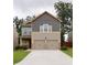 Charming two-story home featuring a two-car garage and neutral color palette at 4630 Roseman Trl, Cumming, GA 30040