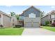 Charming two-story home with a two-car garage and well-maintained lawn in a suburban neighborhood at 4630 Roseman Trl, Cumming, GA 30040
