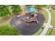 Aerial view of a colorful playground area with slides, swings, and climbing structures for active outdoor fun at 4630 Roseman Trl, Cumming, GA 30040