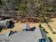 Aerial view of backyard featuring a deck with covered dining, storage shed, and a fenced yard at 492 Thorn Creek Way, Dallas, GA 30157