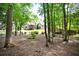 A lush backyard showcases a home with a deck and gazebo perfect for relaxation and outdoor entertainment at 492 Thorn Creek Way, Dallas, GA 30157